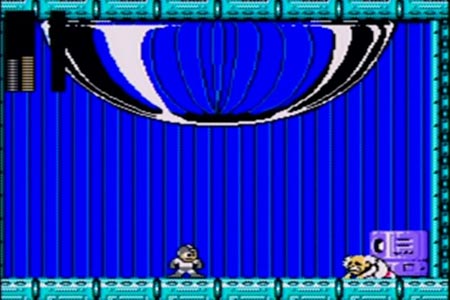 After blowing away the final alien-like form of Dr. Wily Mega man is now standing over a begging Dr. Wily in a lit up control room.